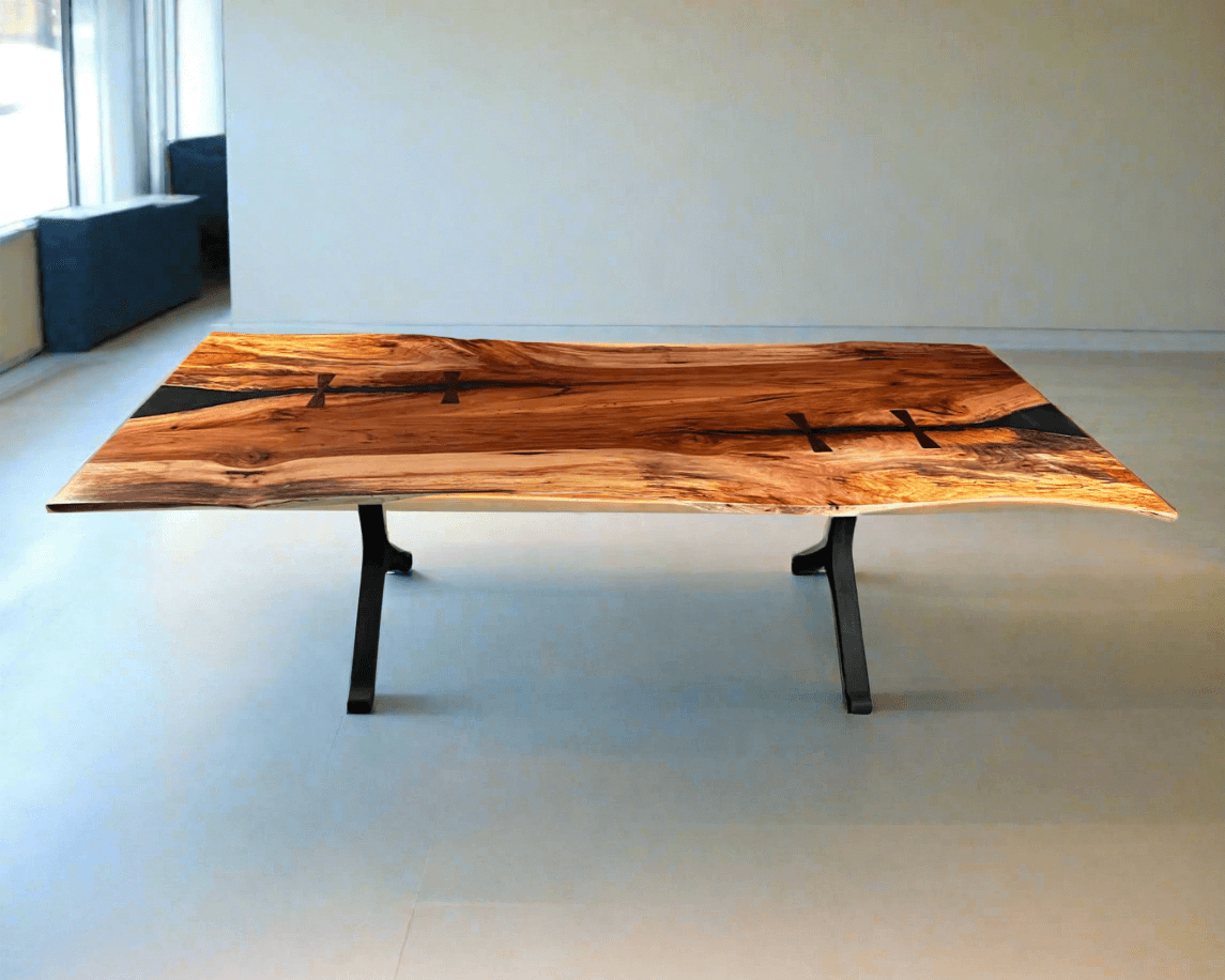 Epoxy river conference table with natural wood grain and black epoxy accents in a modern office setting.