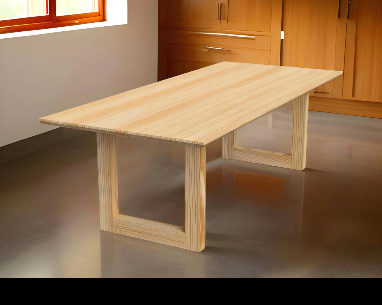 Modern wood dining table with U-shaped trestle base, The Bonita, in a contemporary dining room setting.