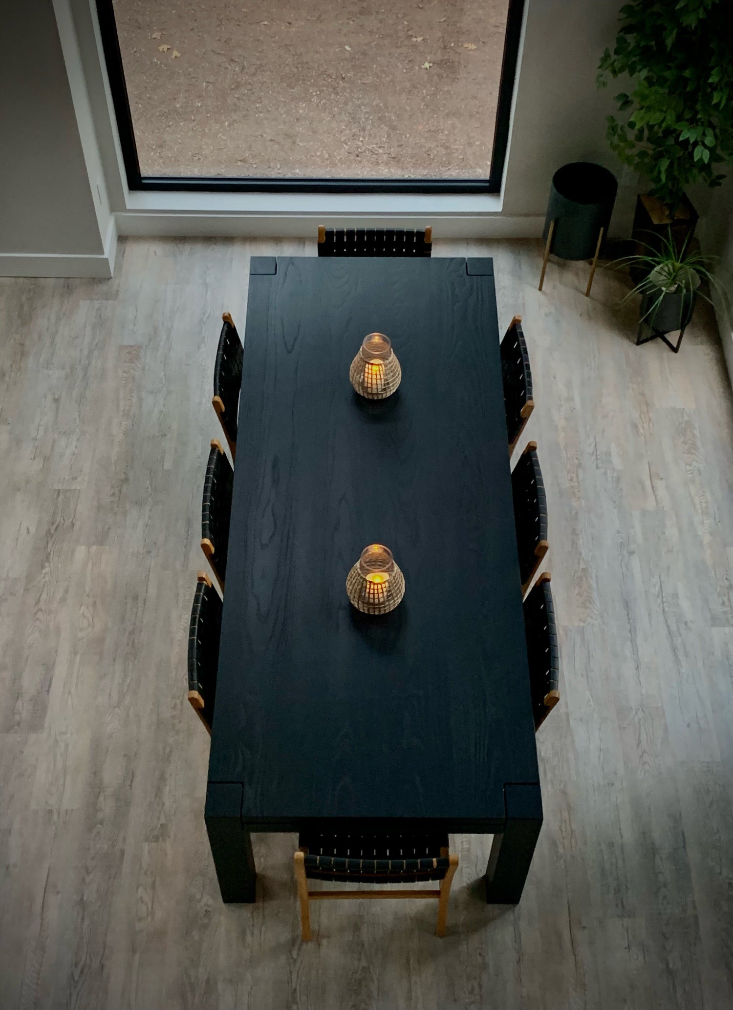 Handmade wooden dining table with unique wood grain pattern, showcasing craftsmanship and style for an elegant dining room.