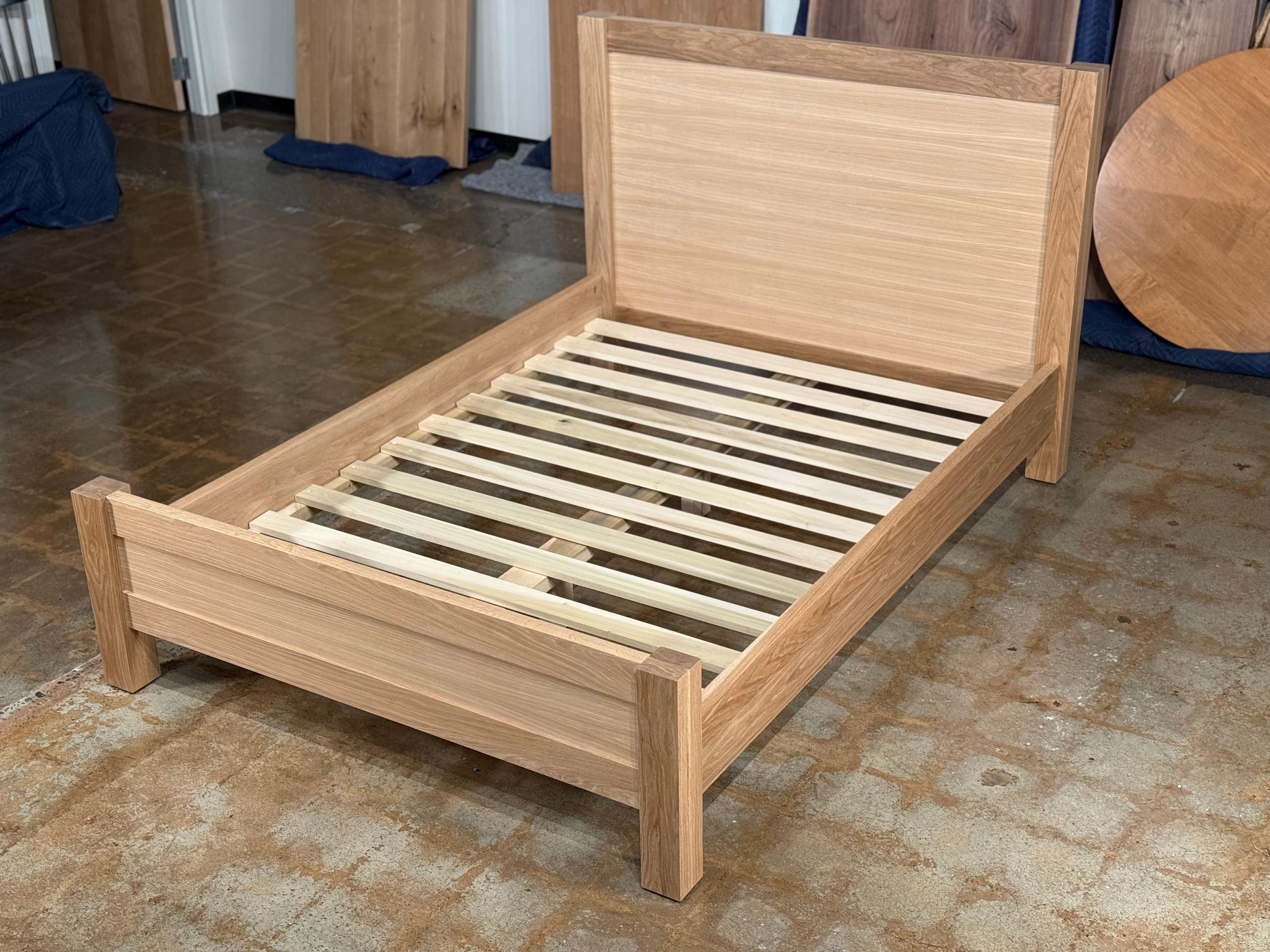 Wooden bed frame with solid wood slats
