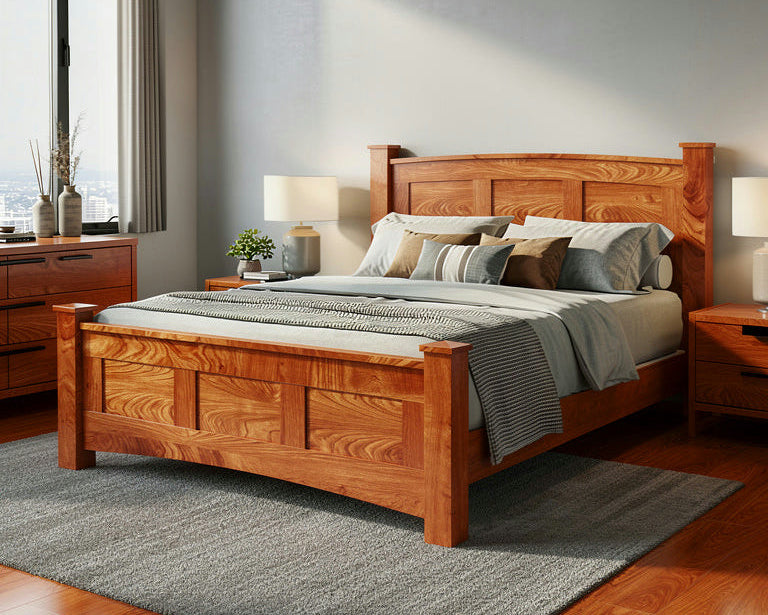 Wooden bed in a bedroom with gray walls and large windows.