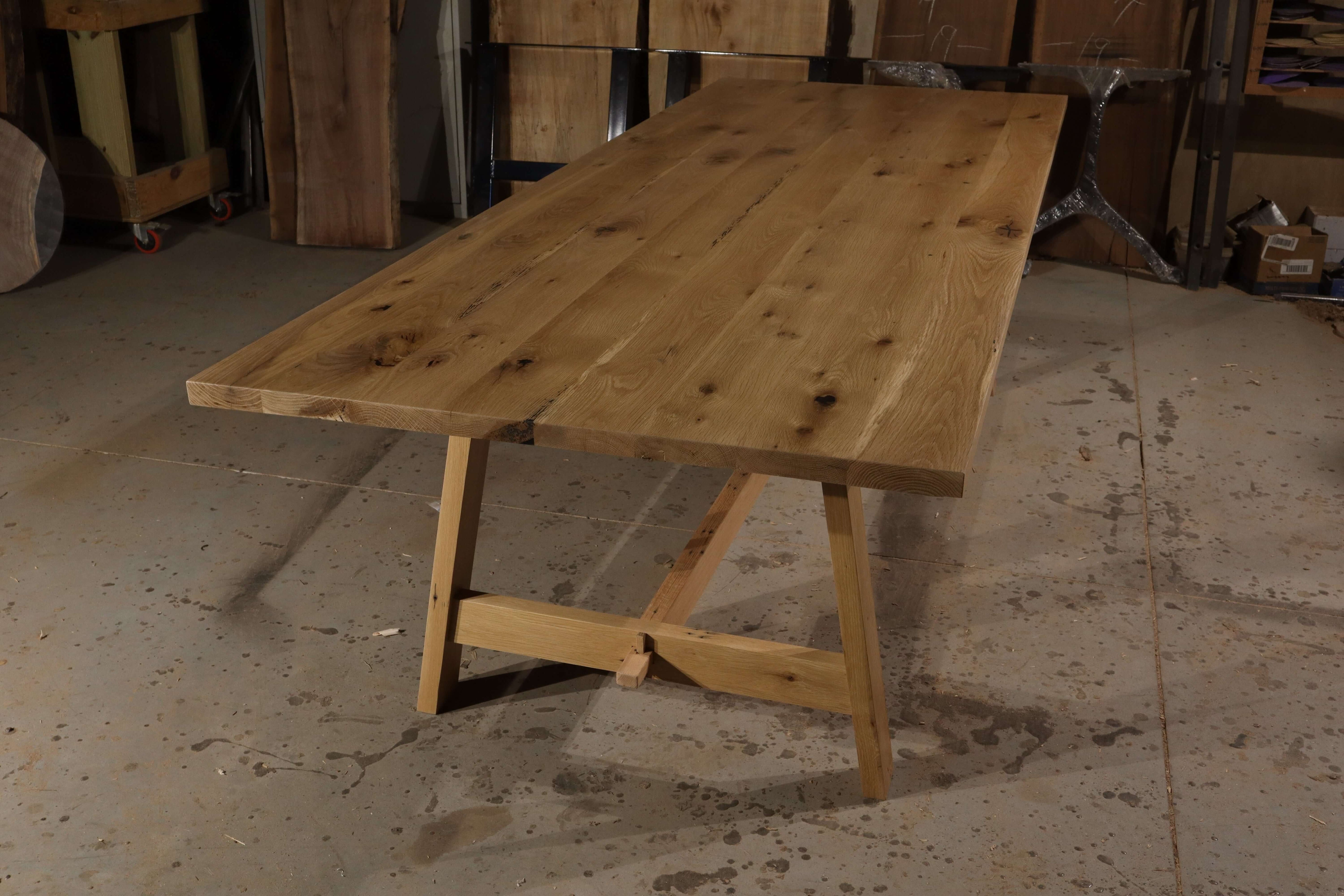Rustic BierGarten farmhouse trestle table made from solid wood, featuring sturdy bases and a natural finish, perfect for gatherings.