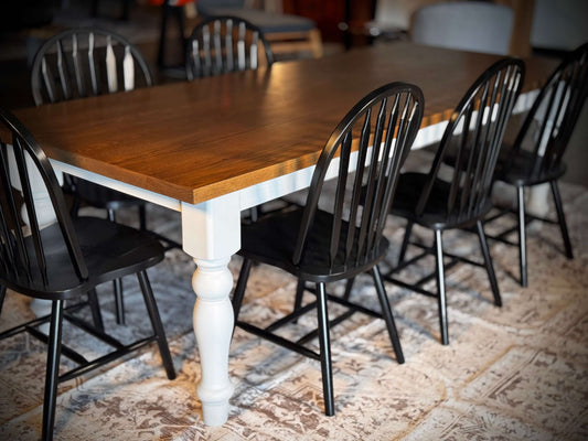 Farmhouse style tabletop with pecan stain and slat-back windsor chairs