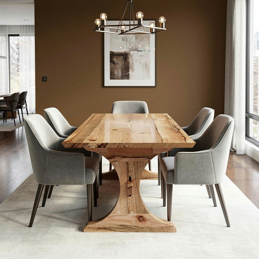 Dining room with wooden table and gray chairs against a brown wall.