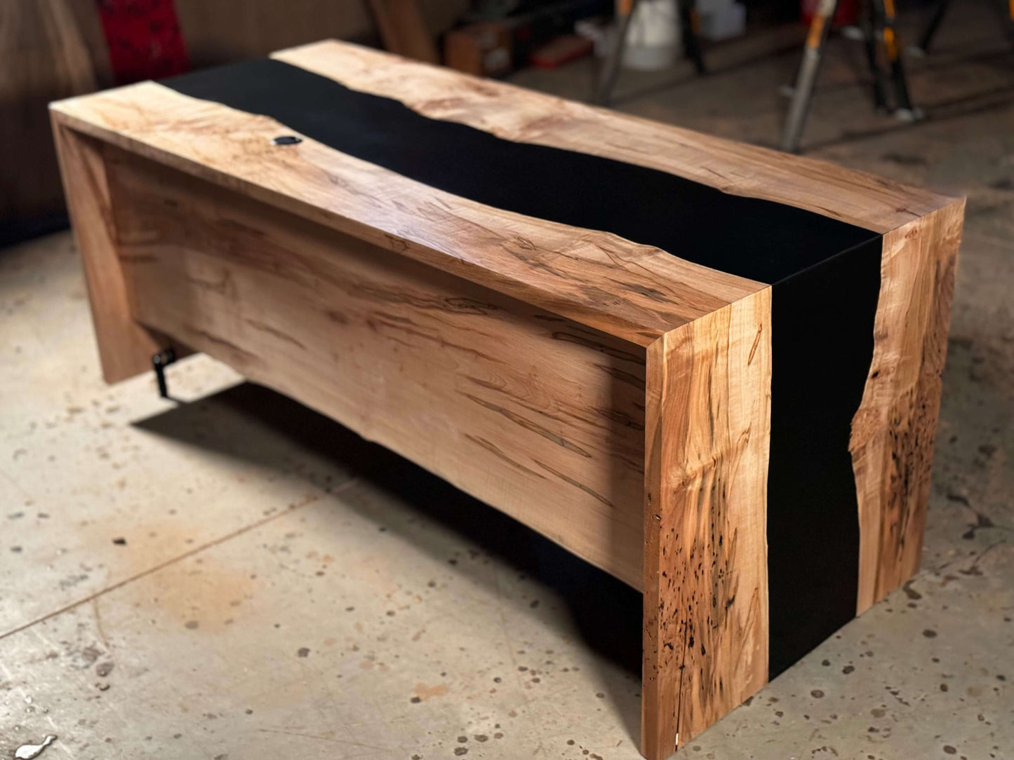 Custom epoxy resin desk with natural wood finish for a unique and stylish office workspace.