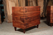 Mid-century modern custom sapele nightstand with wrap-around grain and dual mount hardware, showcasing luxury and style.