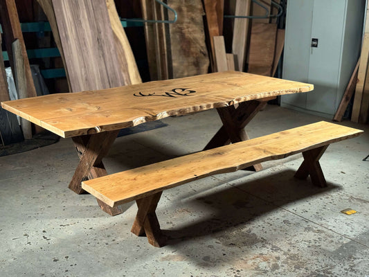 Solid wood dining table set with classic design, featuring The Medlin and matching bench, ideal for elegant dining rooms.