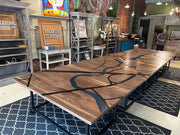 Custom engraved conference table with Greenville map and Reedy River design in Packaging School setting