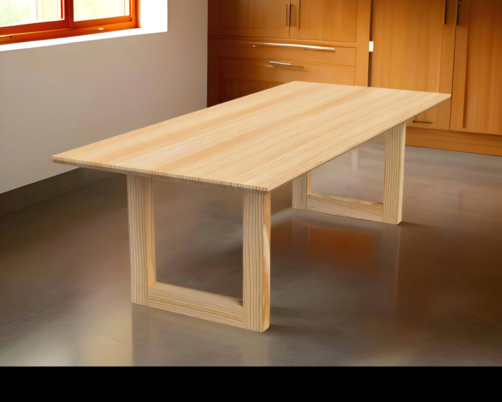 Modern wood dining table with U-shaped trestle base, The Bonita, in a contemporary dining room setting.